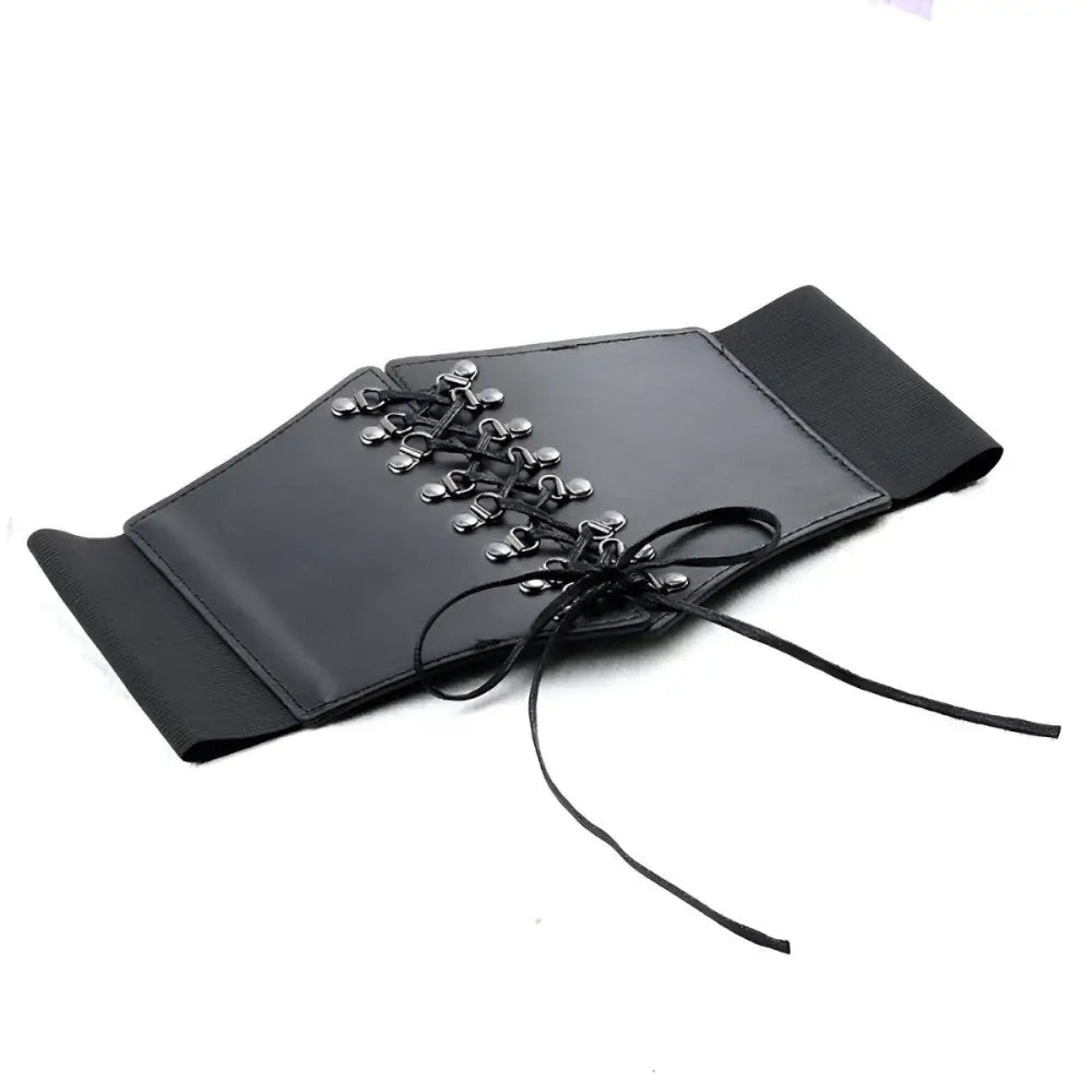 Black faux leather corset belt displayed on a stylish and elegant look for women
