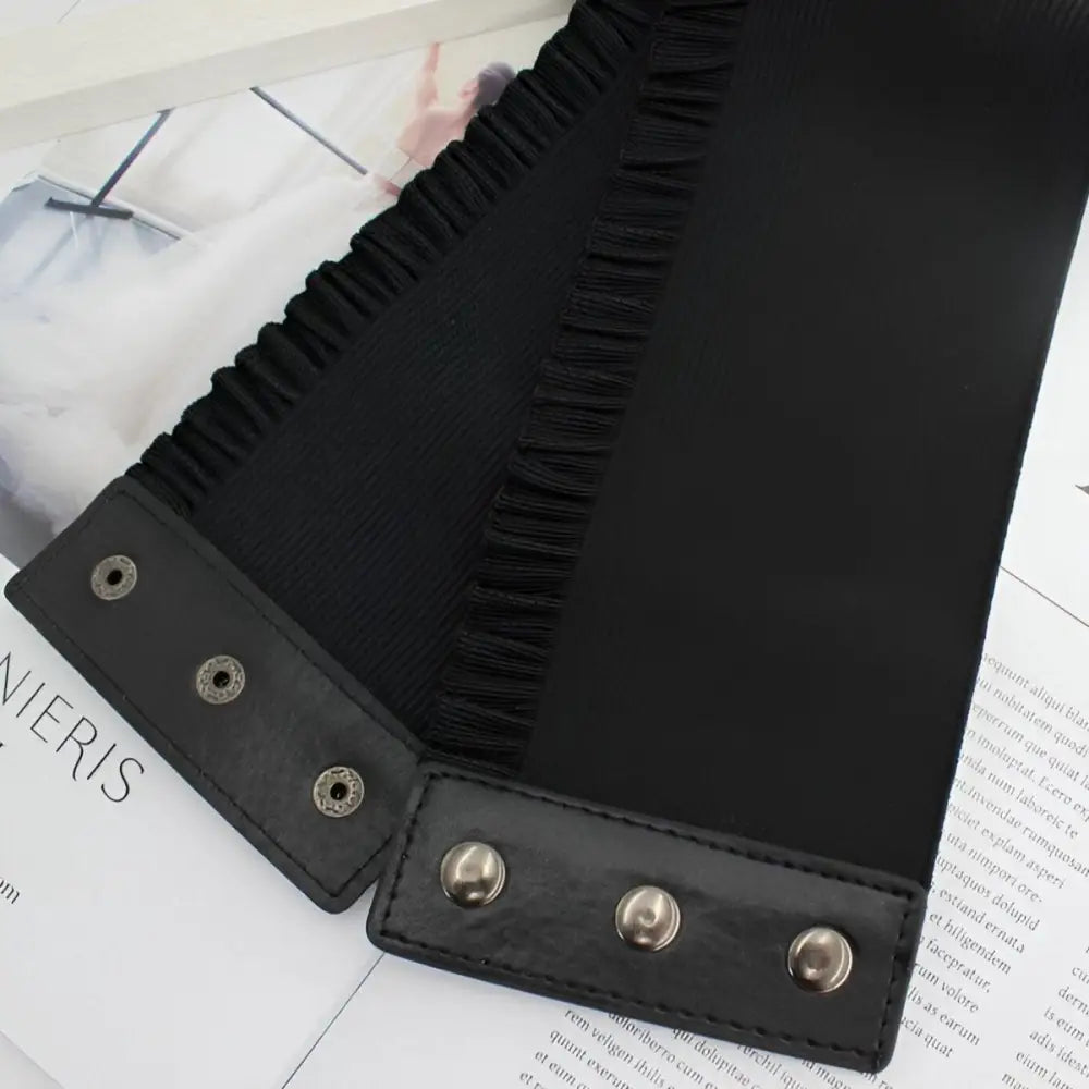 Black elastic corset belt with snap closures for stylish occasion wear