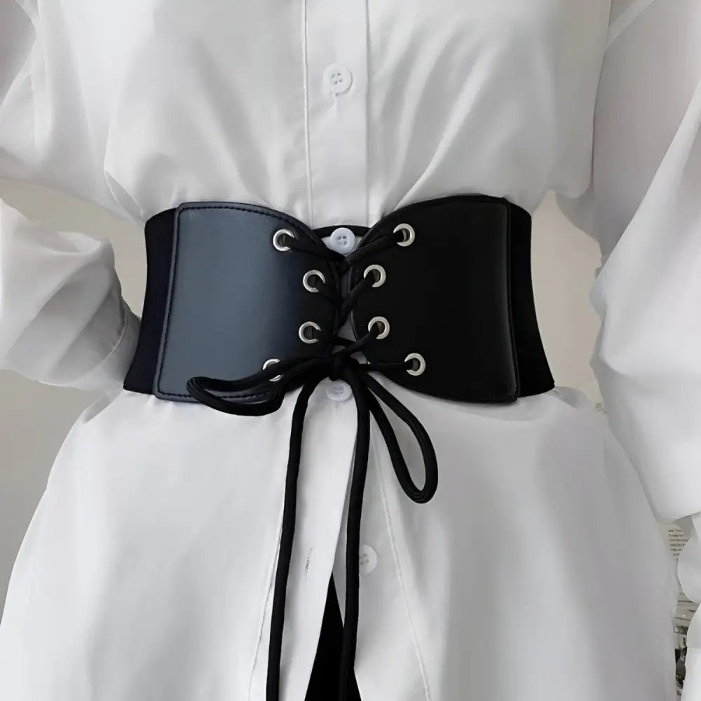 Black corset belt with lace-up front for elegant styling and fashion statement