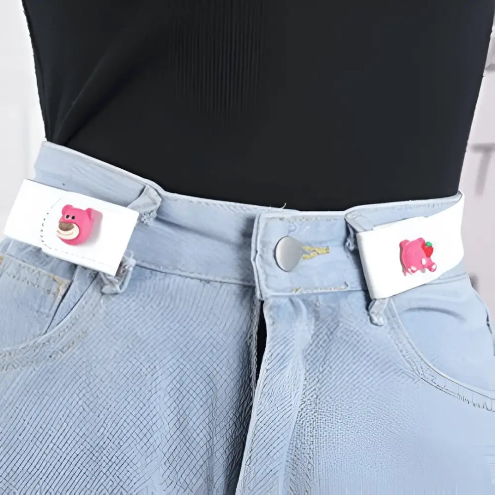 Mélusine belt with jeans featuring cartoon waist adjusters and bear-shaped fasteners