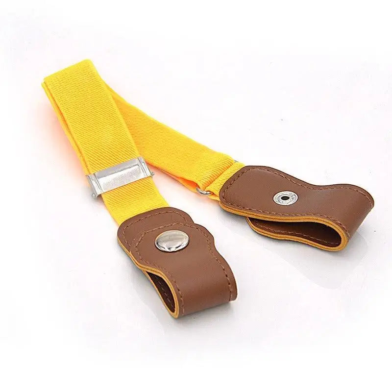 Yellow elastic belt with brown leather ends on women’s denim shorts featuring sans boucle style
