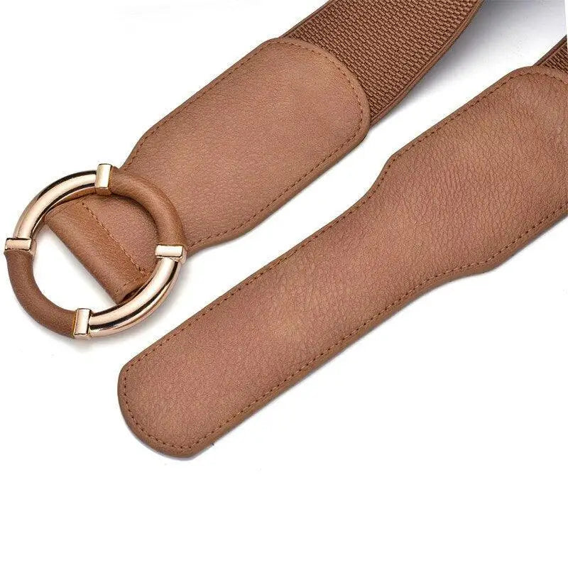 Black elastic belt with a gold circular buckle, suitable for dresses and outfits