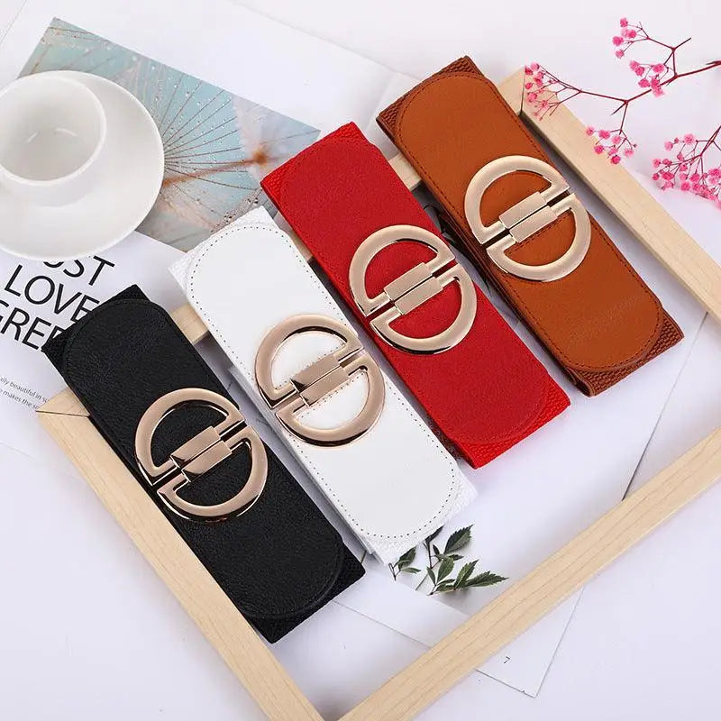 Set of four colorful elastic belts with gold buckles for stylish accessories