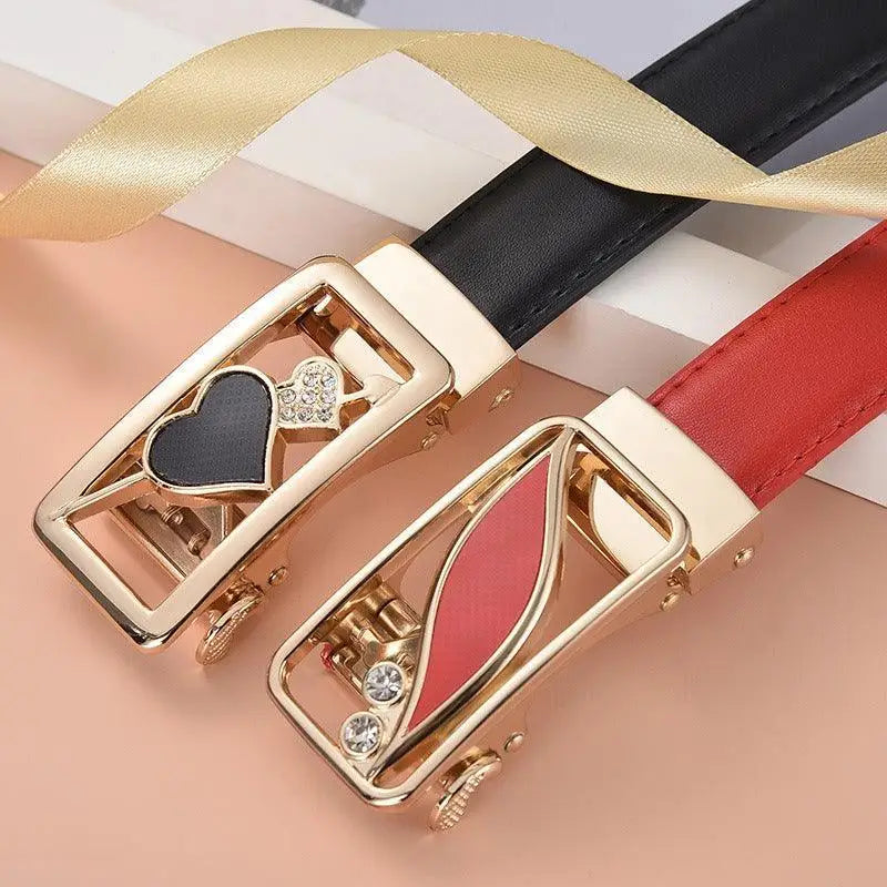 Two decorative red leather belt buckles with gold accents for stylish accessories