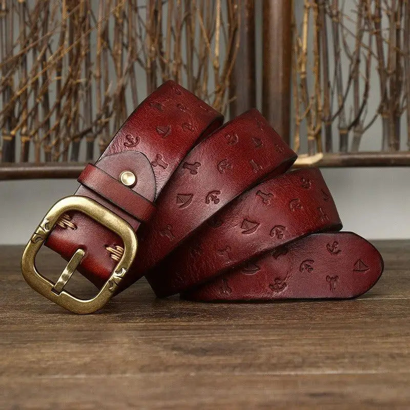 Embossed brown leather belt with brass buckle for stylish accessories