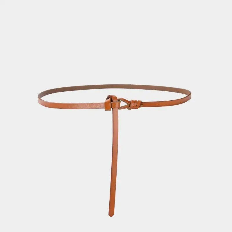 Brown leather tie belt with knotted closure enhances aesthetic appeal and versatile style