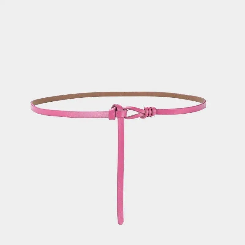 Pink leather tie belt with knotted detail showcasing stylish aesthetic appeal