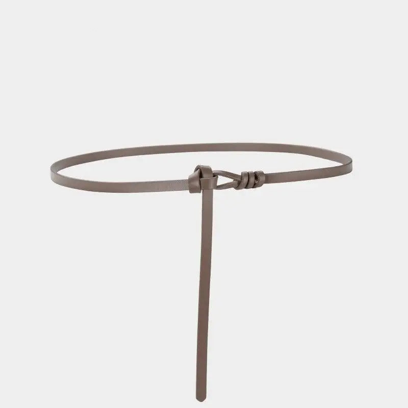 Elegant thin brown leather tie belt with knot detail showcasing aesthetic appeal