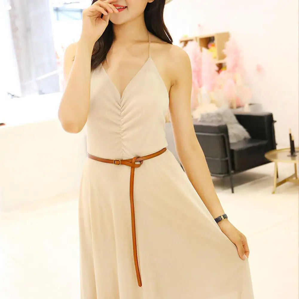 Beige halter dress with brown belt and gold buckle for elegant summer wear
