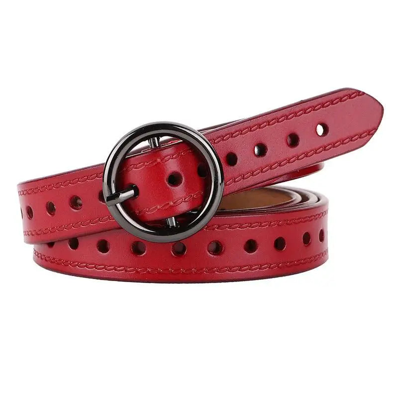 Red leather belt with circular buckle displayed with a White Cardigan with Red and Blue Trim