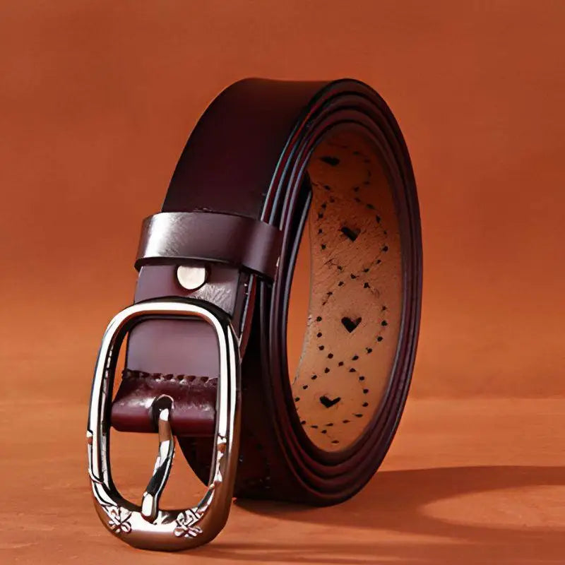 Burgundy Talma perforated leather belt with decorative cutouts and silver buckle