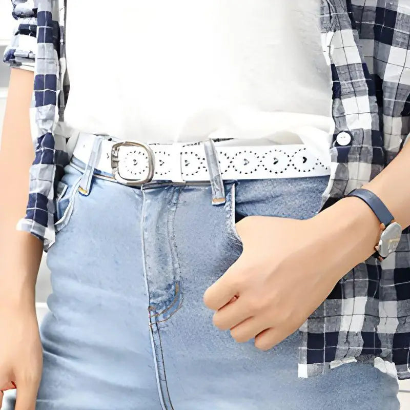 White perforated leather belt from Talma with decorative cutouts for stylish wear