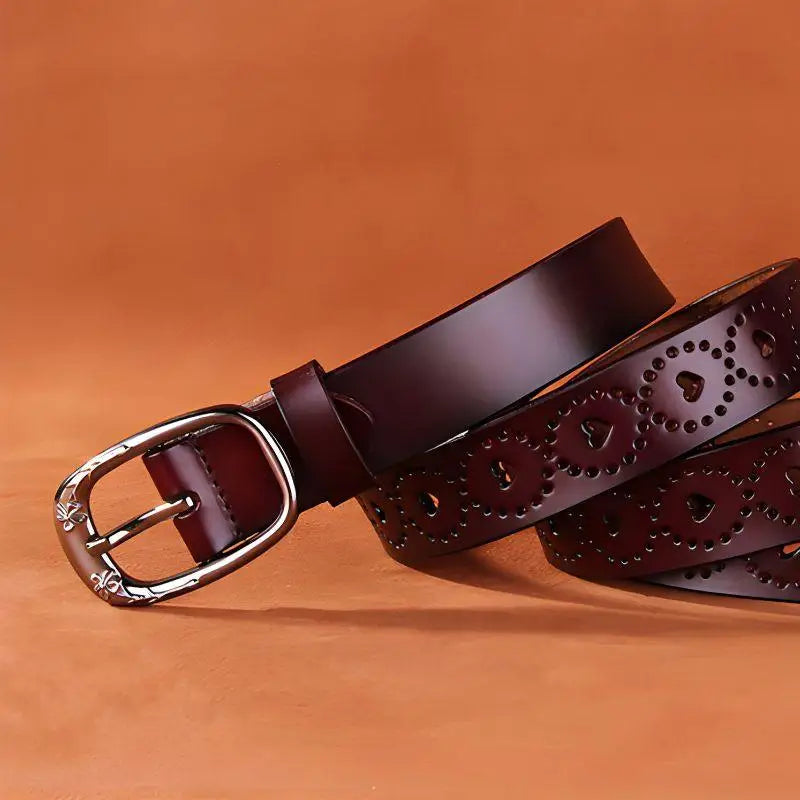 Burgundy Talma perforated leather belt with heart cutouts and silver buckle for stylish wear