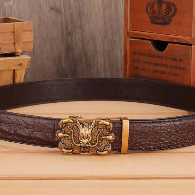 Brown crocodile leather belt with a detailed dragon-shaped buckle for stylish appeal
