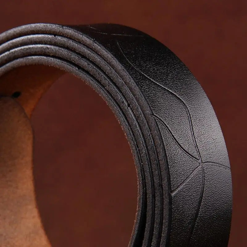 Black leather belt with embossed design featured in Leather Belts with Decorative Buckles in Various Colors