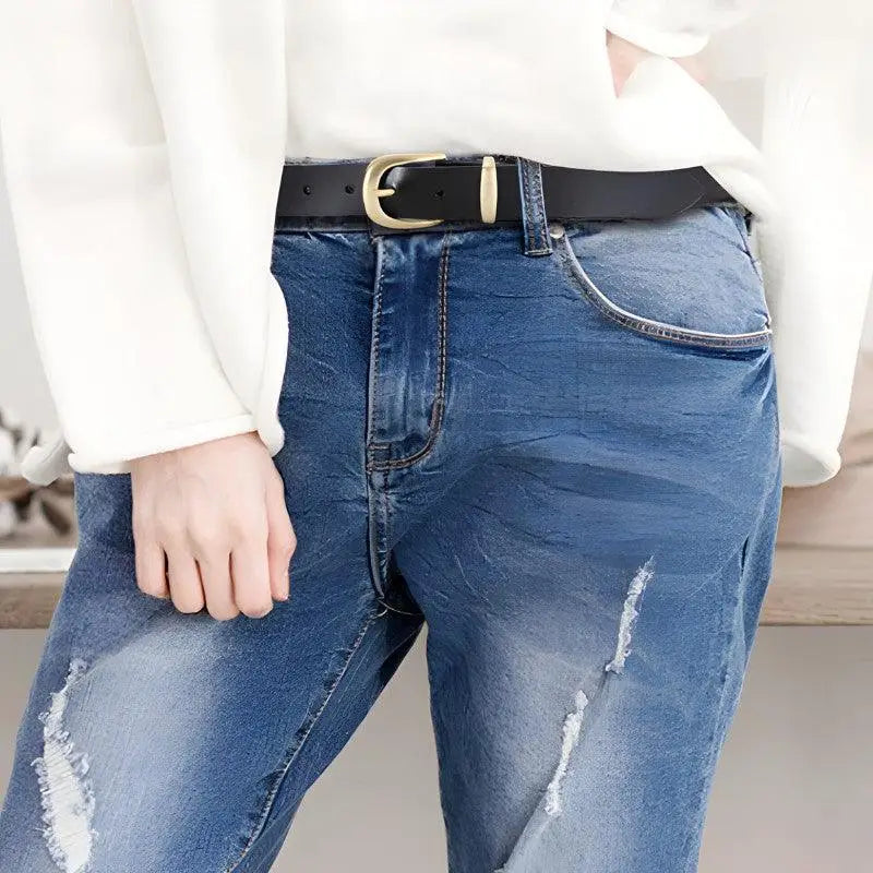 Distressed Blue Jeans with a Golden Buckle Leather Belt showcasing ripped blue denim