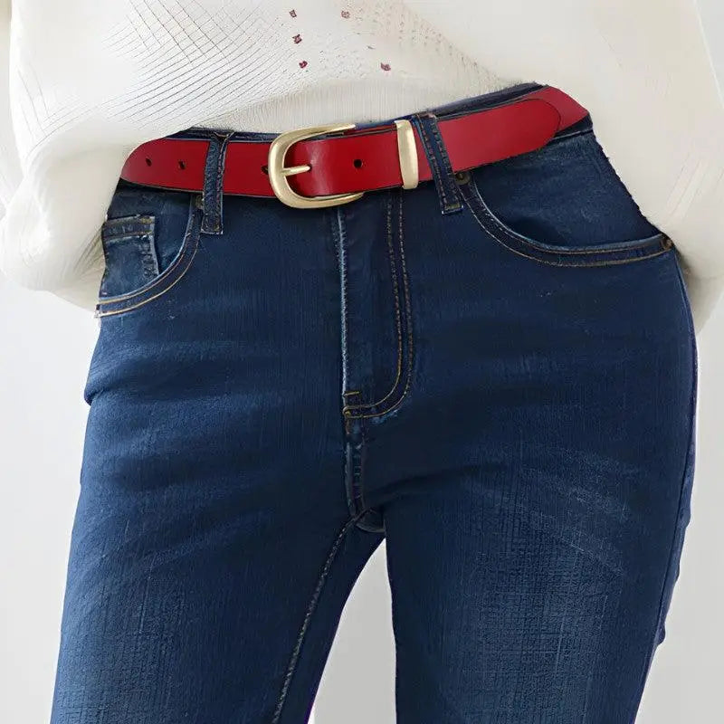 Red leather belt featuring a prominent golden buckle from Distressed Blue Jeans collection