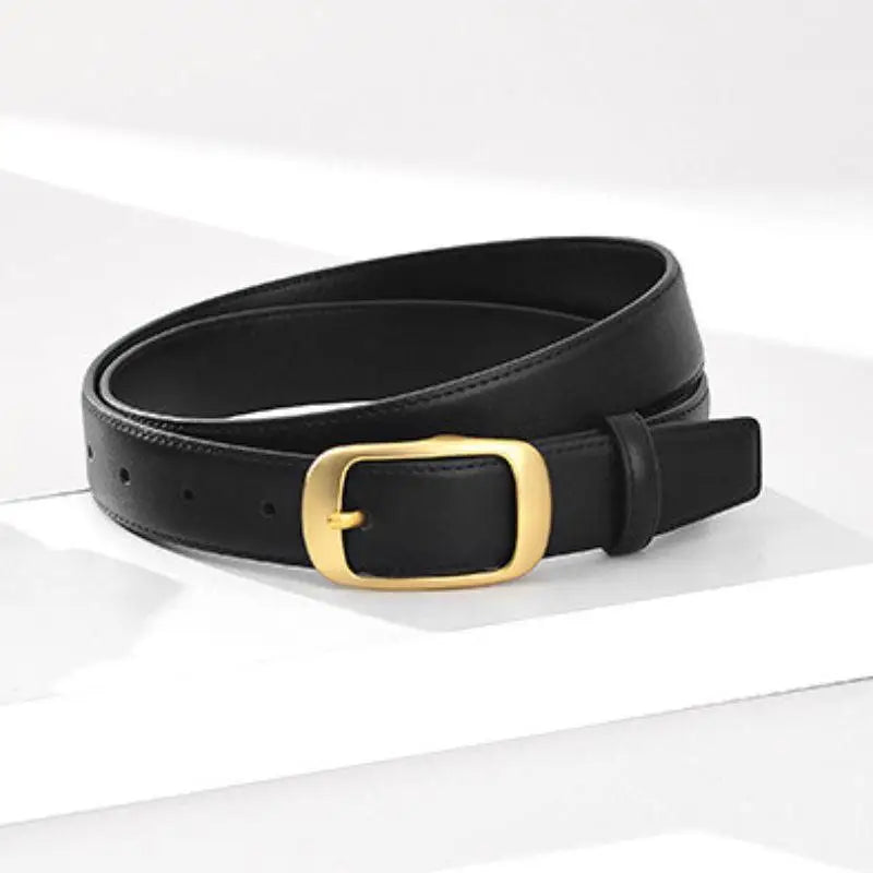 Elegant black leather belt with a gold buckle for women featuring stylish accessory