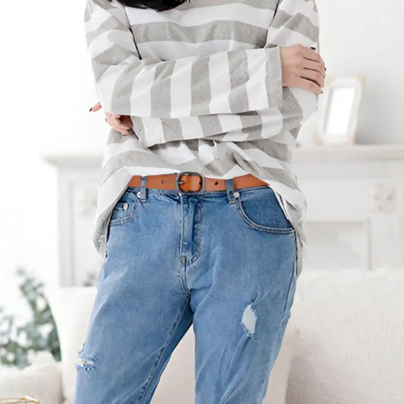 Light-wash distressed jeans with a brown Anni Leather Belt and Ceinture en Cuir in various colors