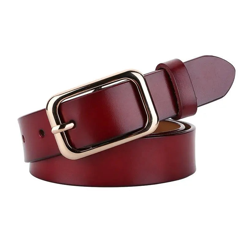 Burgundy leather belt with gold buckle from Women’s Outfit Featuring White Sweater Blue Jeans and Gold Buckle Belts