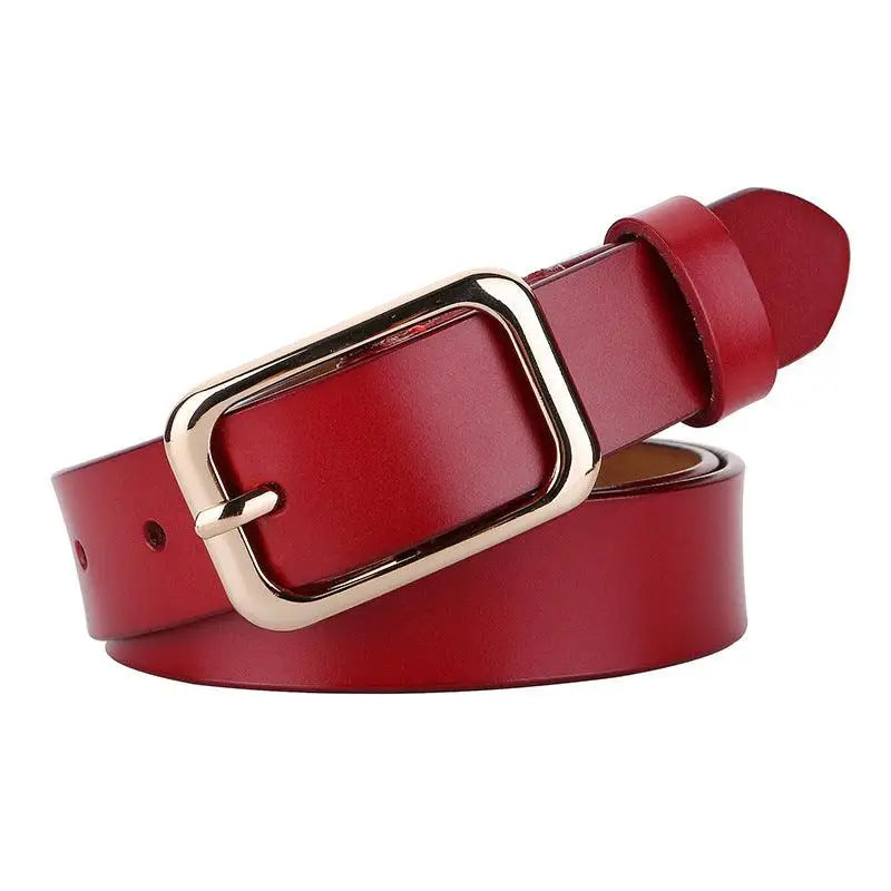 Red leather belt with gold buckle from Women’s Outfit Featuring White Sweater Blue Jeans and Gold Buckle Belts