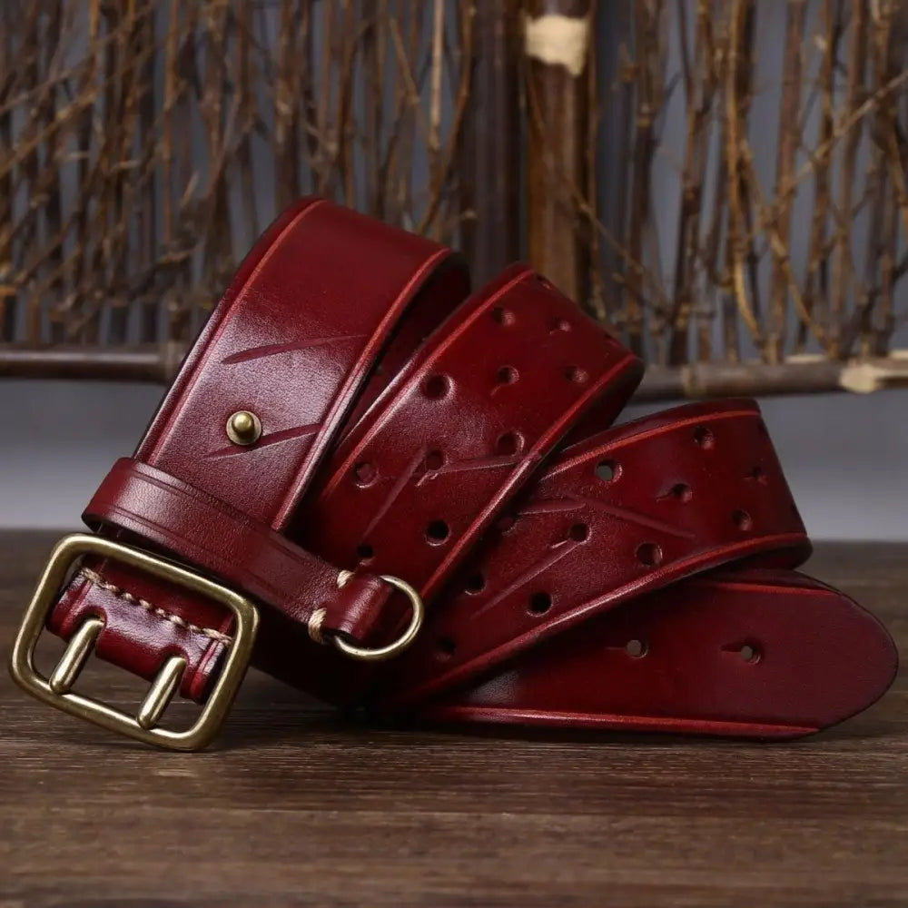Osomache leather belt with gold buckle in maroon display of Osomache Leather Belts collection