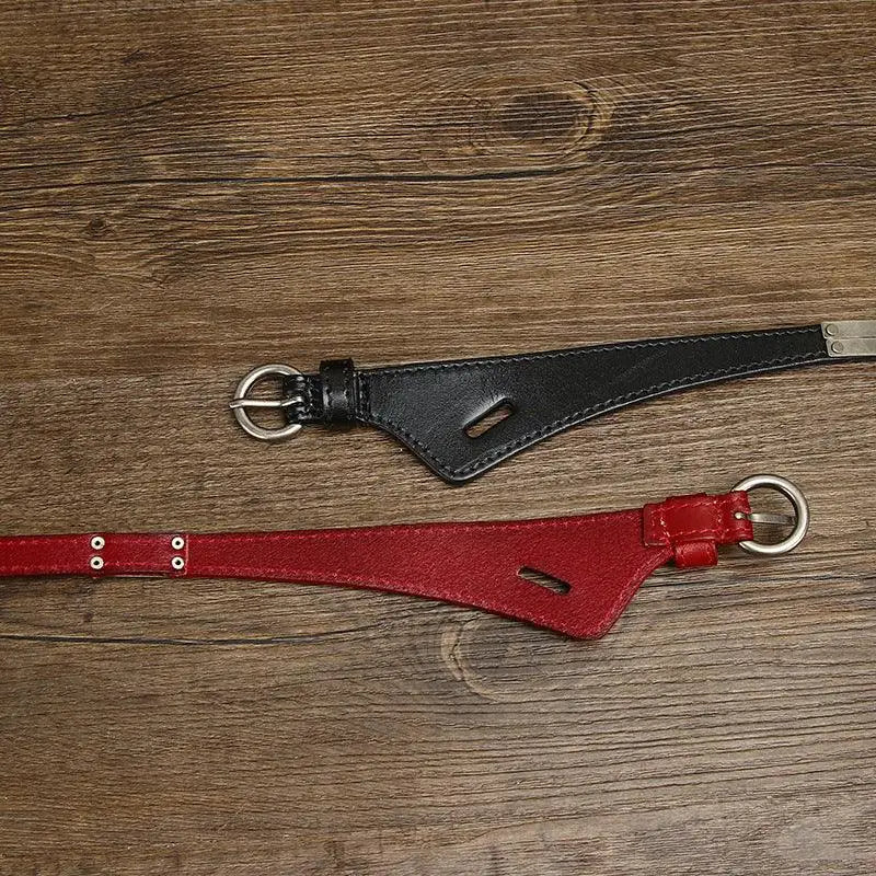 Black and red leather belts from the Priya Belt Collection with metal buckles