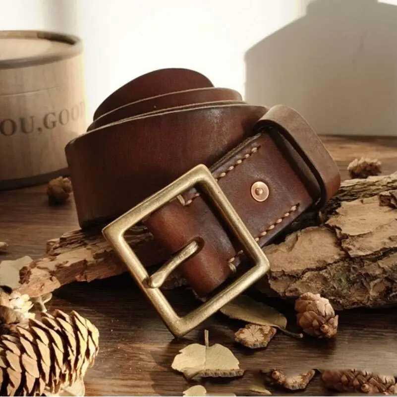 Set of two brown leather belts with brass buckles displayed for stylish men’s fashion
