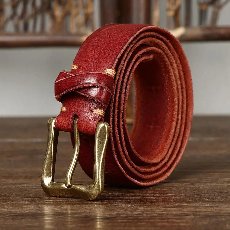 Red leather belt with a brass buckle for fashion and accessories
