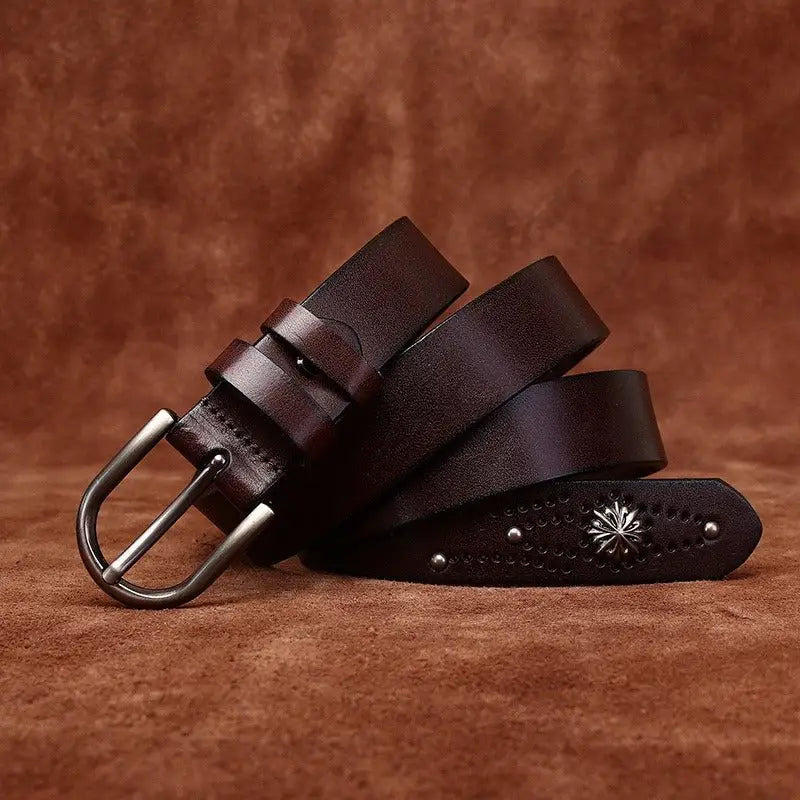 Brown leather belt with silver buckle and decorative end for stylish accessories