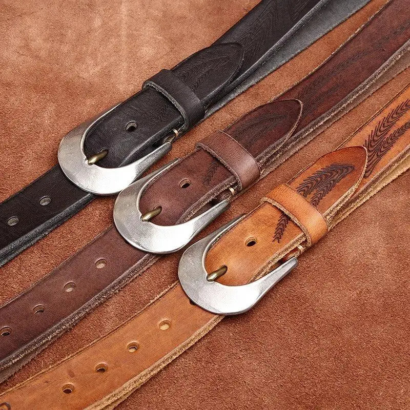 Set of three leather belts with silver buckles displayed for fashion and accessories