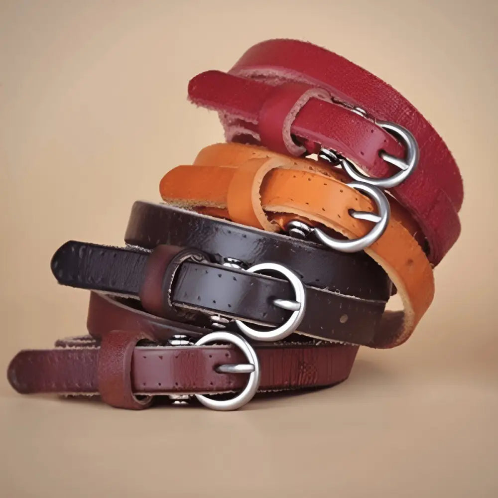 Stacked colorful leather belts set for dresses and outfits showing vibrant fashion accessories