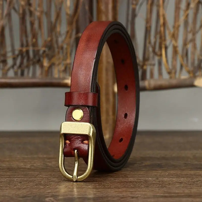 Set of four full-grain leather belts with brass and gold buckles for versatile style