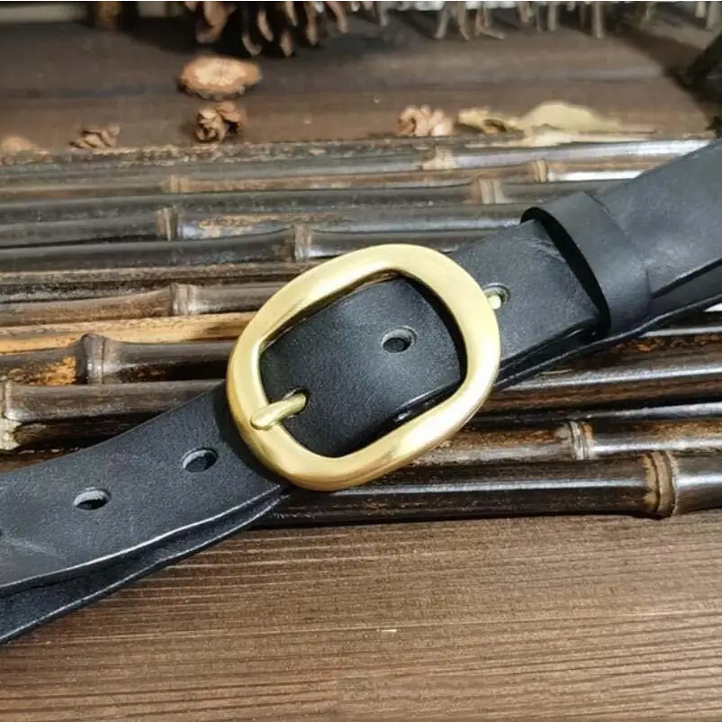 Black leather belt with brass buckle to complement classic style attire