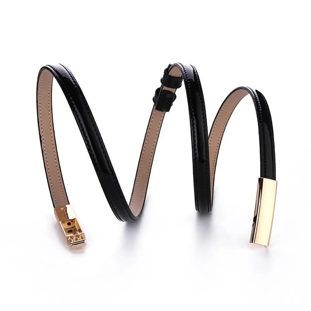 Black patent leather belt with gold buckle from the Stacked Patent Leather Belts collection