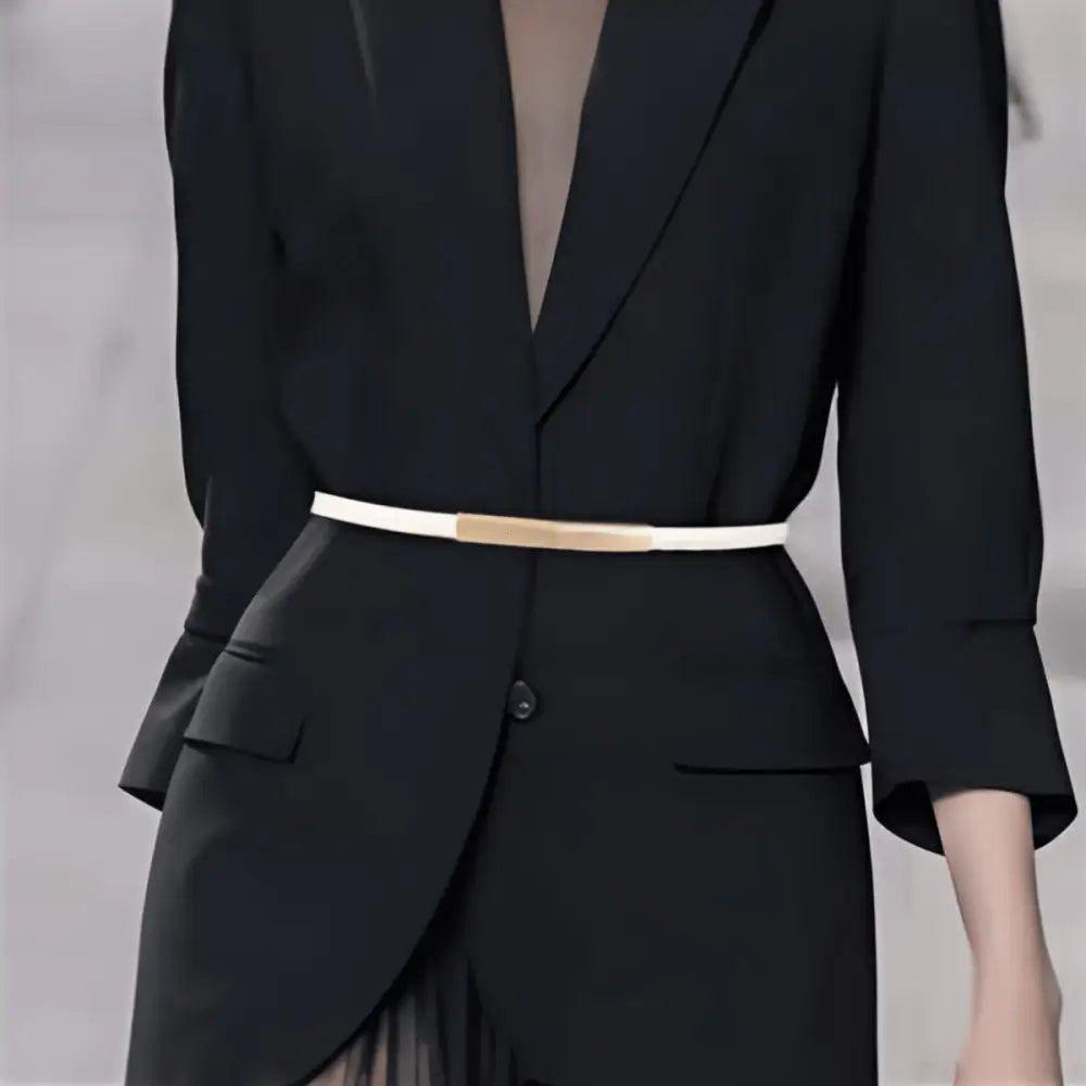 Black blazer featuring a thin white belt from Stackeated Patent Leather Belts with Gold Buckle collection