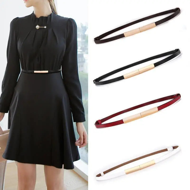 Black dress featuring stacked patent leather belts with gold buckles for elegant style