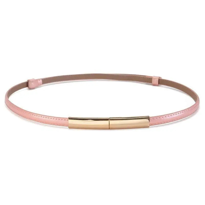 Pink patent leather belt with a gold buckle from the Stacked Patent Leather Belts collection