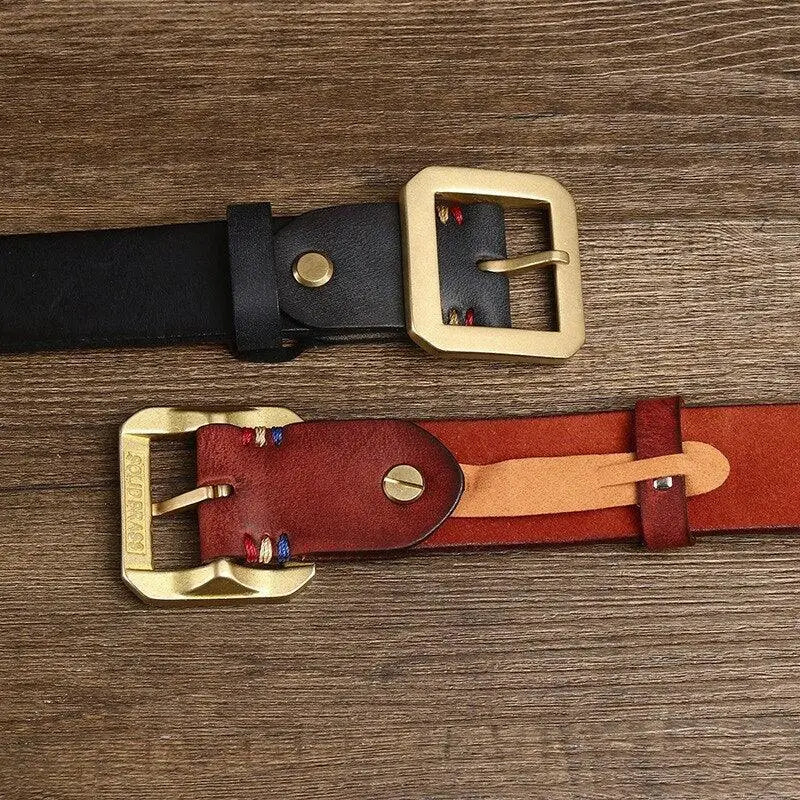 Two leather belts with brass buckles in brown and gold finishes displayed for sale