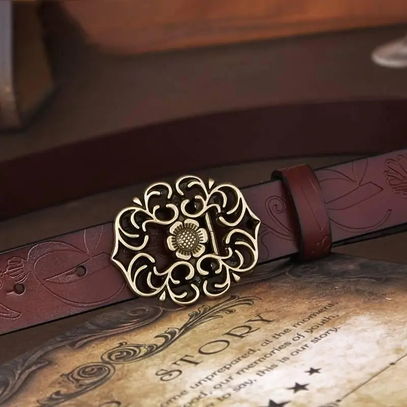Embossed burgundy leather belt with ornate buckle from Leather Belts with Ornate Buckles in Red and Brown