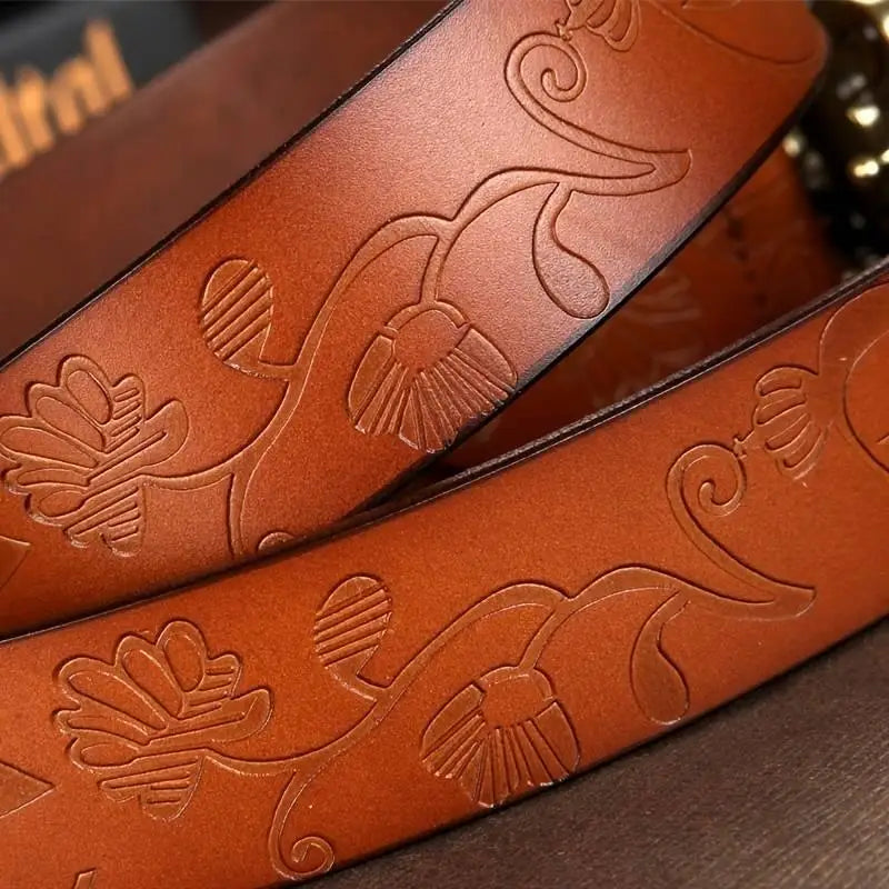 Embossed brown leather belt with ornate buckle from Leather Belts with Ornate Buckles in Red and Brown