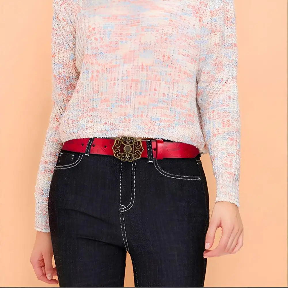 Red leather belt with an ornate buckle displayed in Leather Belts with Ornate Buckles in Red and Brown
