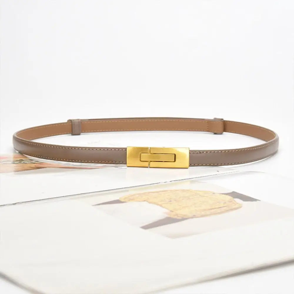 Taupe leather belt with gold buckle to enhance personal style and accessory elegance