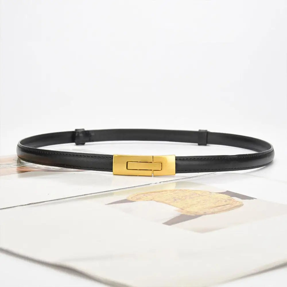 Black leather belt with gold buckle to enhance personal style and sophistication