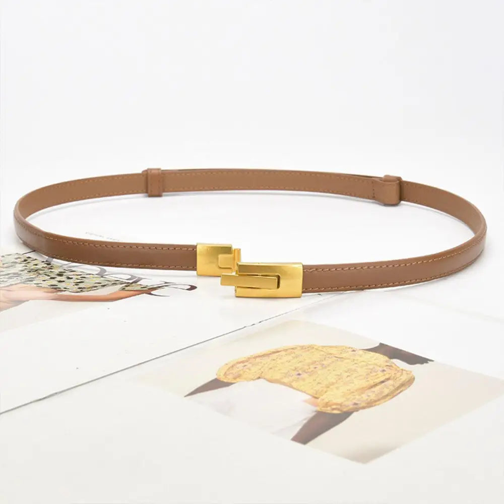 Tan leather belt with gold buckle to enhance personal style and sophistication
