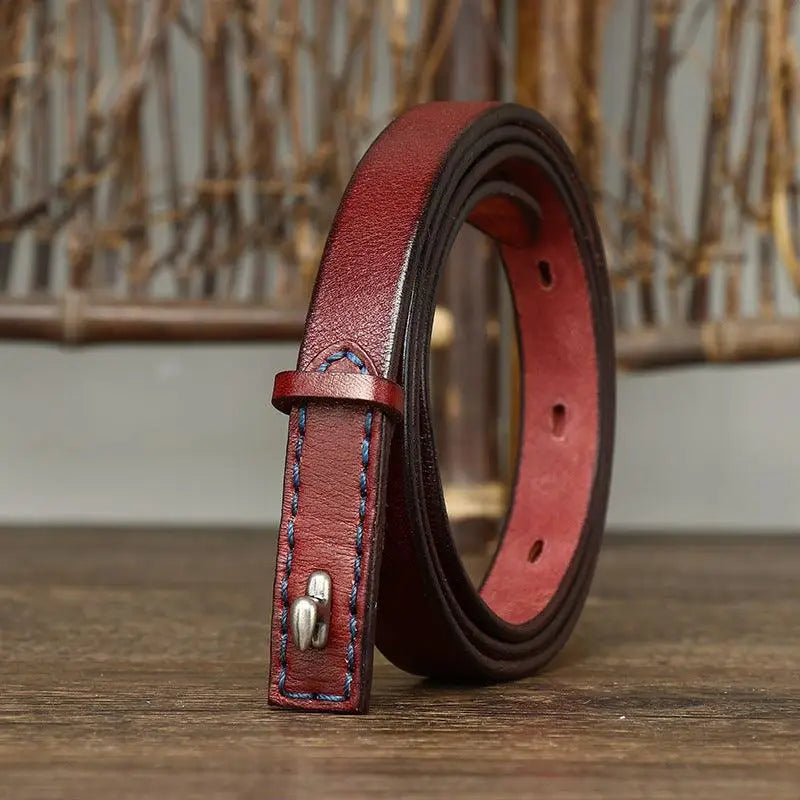 Burgundy leather belt with blue stitching and silver buckle for stylish accessories