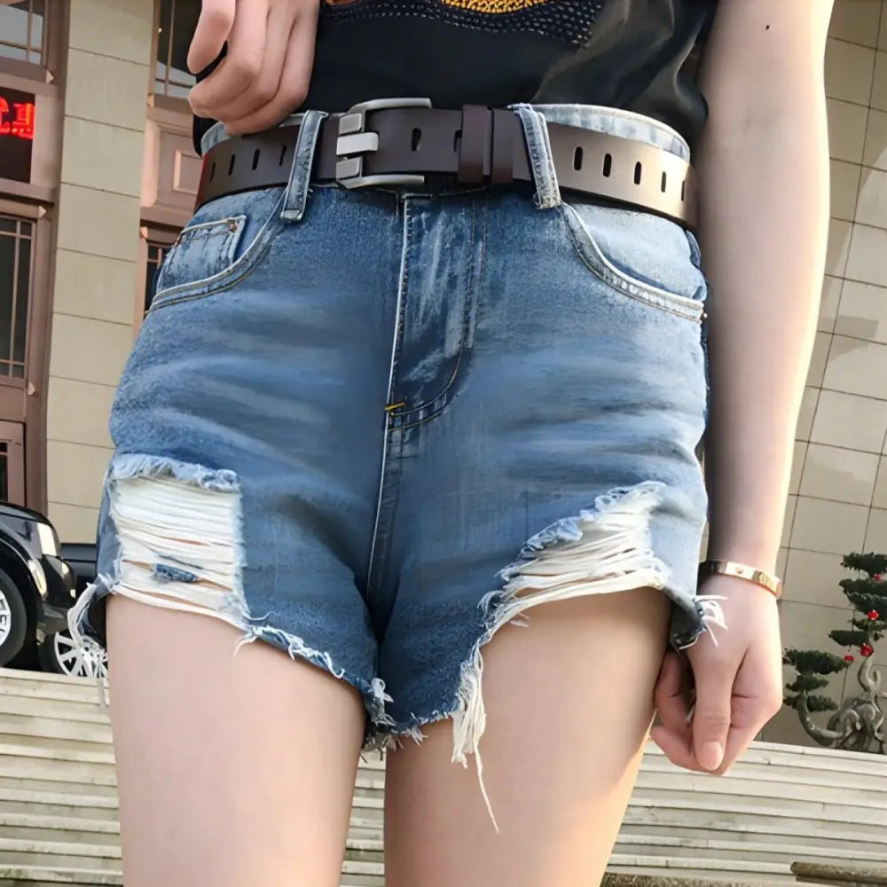 Distressed denim shorts with Gulisa leather belt and red leather band for style