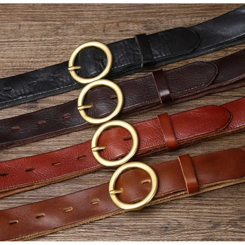 Hasti Belt women’s leather belts with brass and gold circular buckles displayed in a set