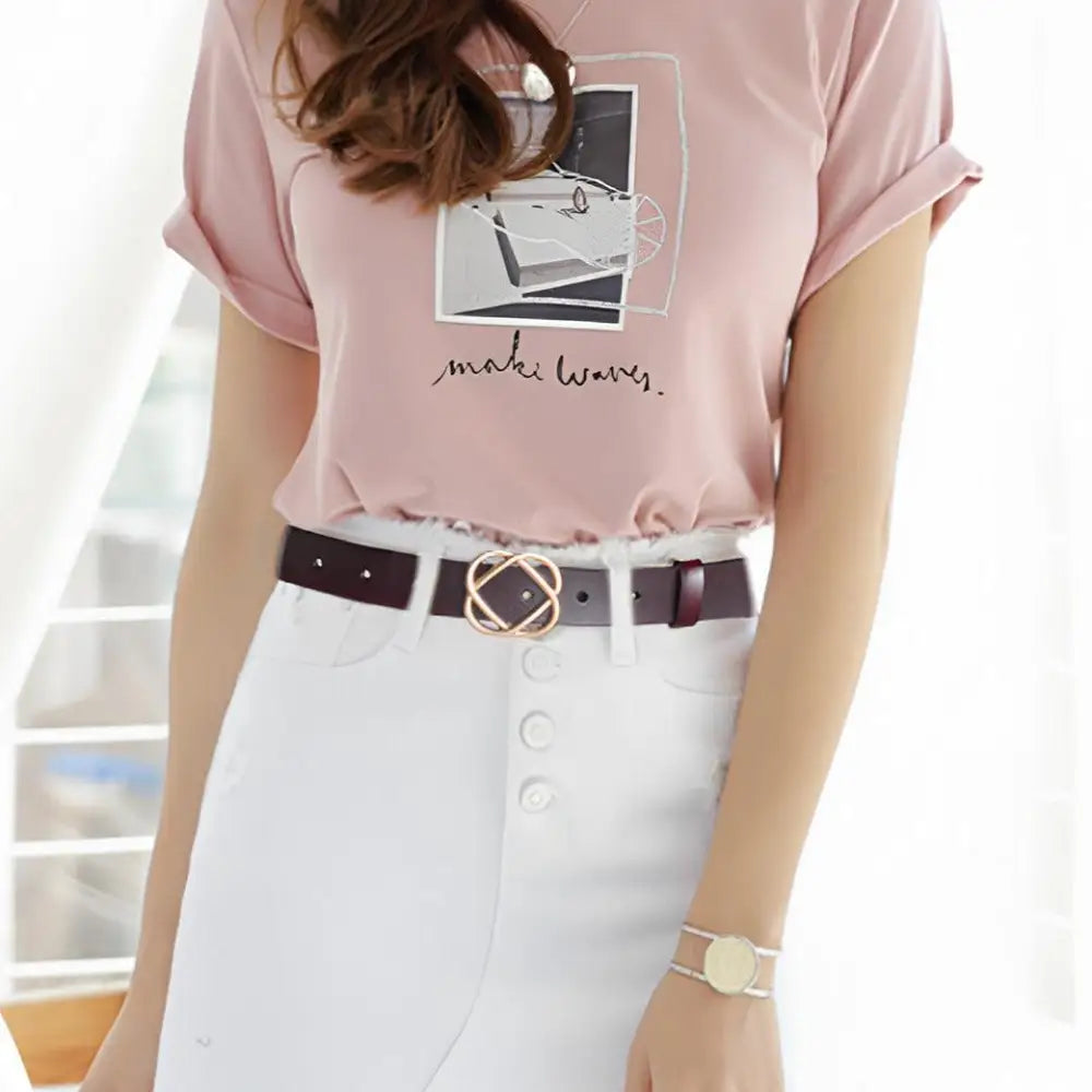 Genuine leather women’s belt with snap buckle paired with pink t-shirt and white skirt