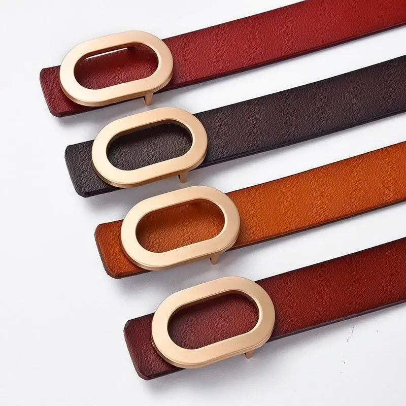 Leather belt display featuring four brown and beige options with oval buckles for men